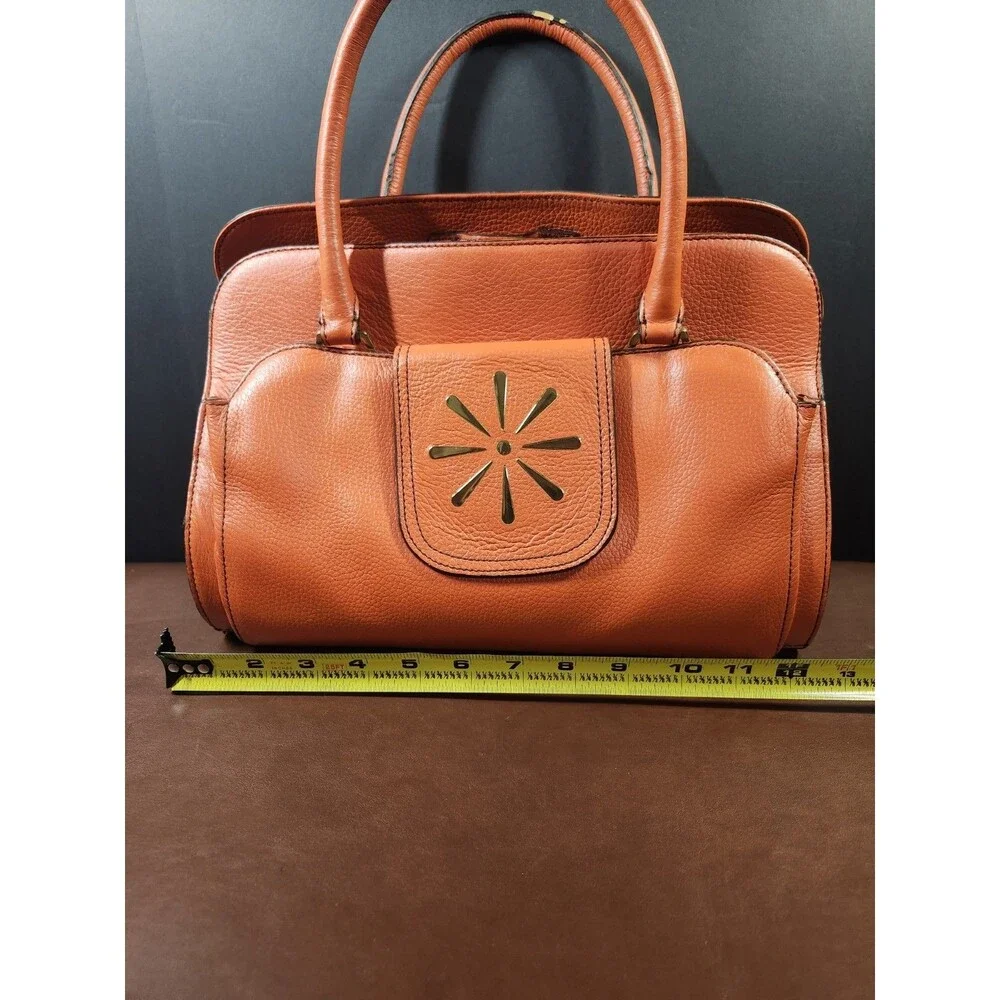 orange pebbled leather top-handle satchel bag by Isaac Mizrahi.